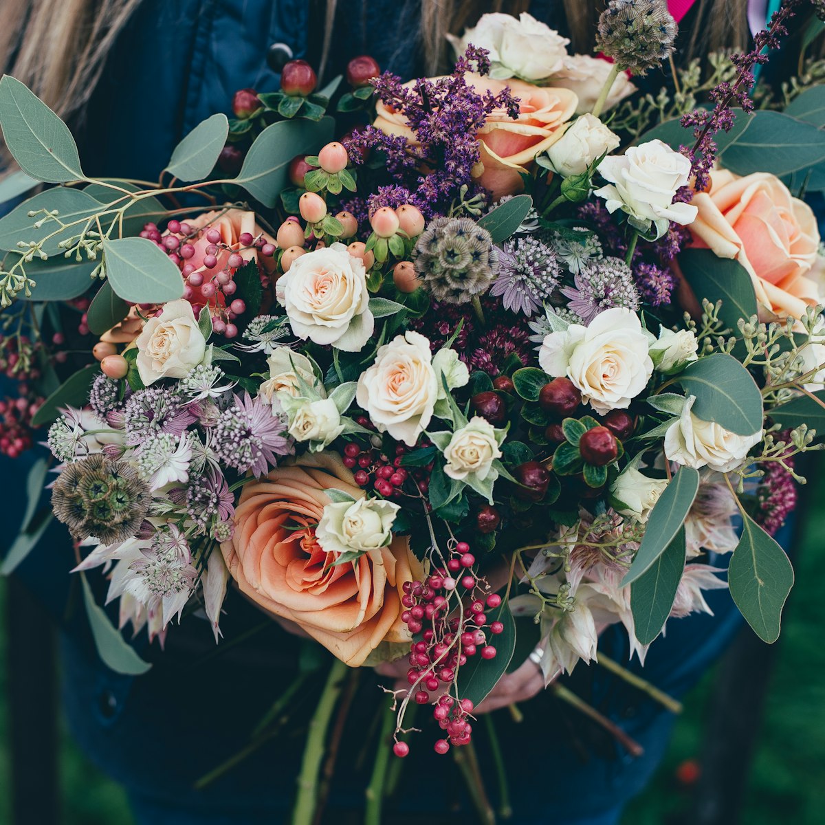 Bridal bouquet of white peonies and olive