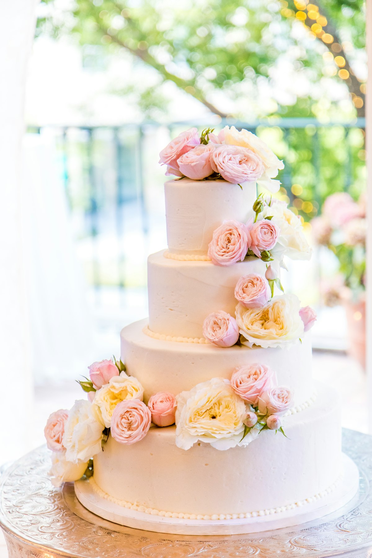 White wedding cake with edible flowers